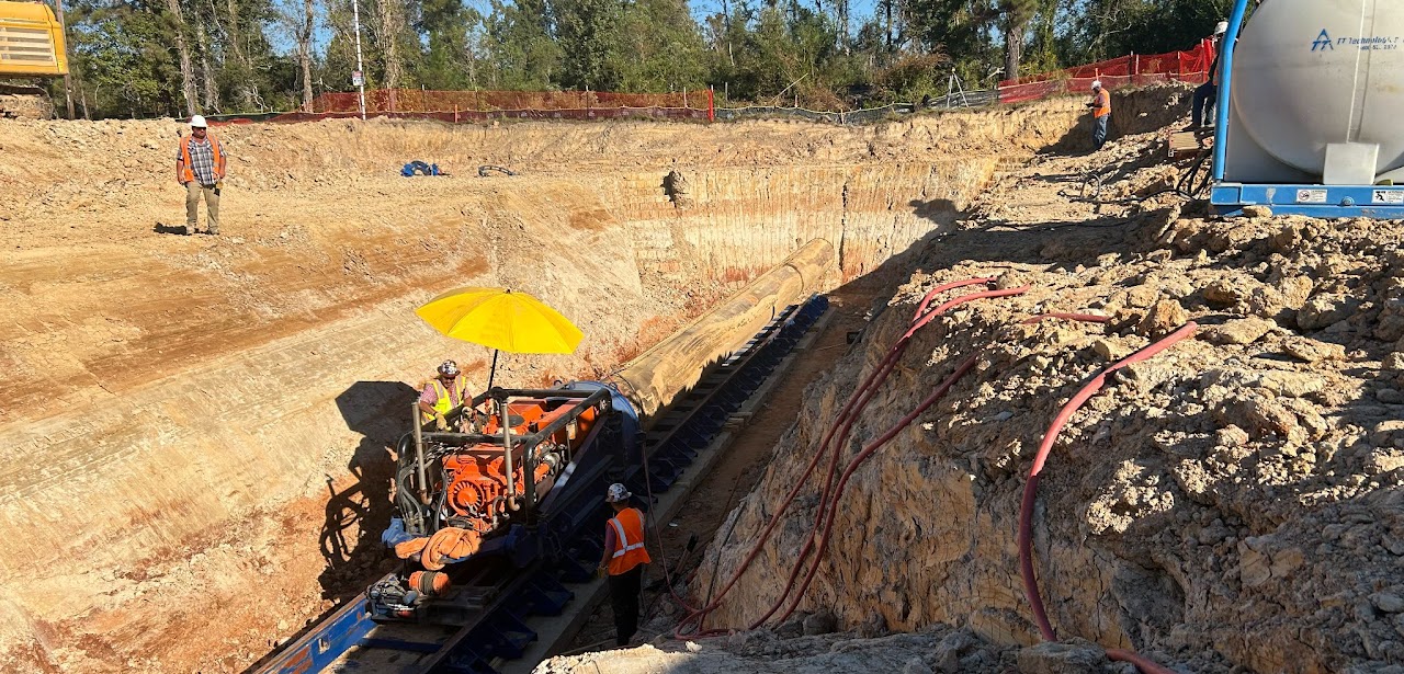 Road bore operation with pit shoring and crew